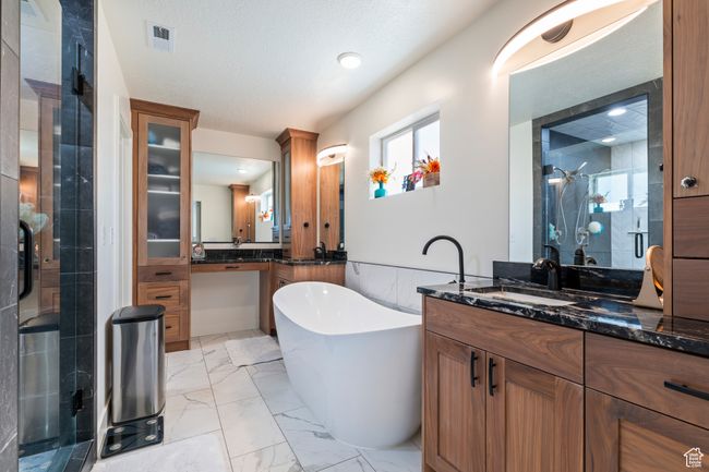 Full bathroom with a soaking tub, vanity, marble finish floor, and a stall shower | Image 22