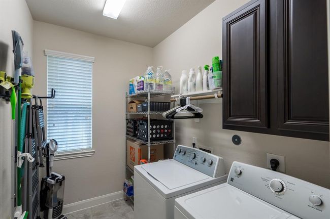 Large laundry room with room for additional storage. There is a fridge hook up if you wanted to have fridge or freezer here. | Image 10