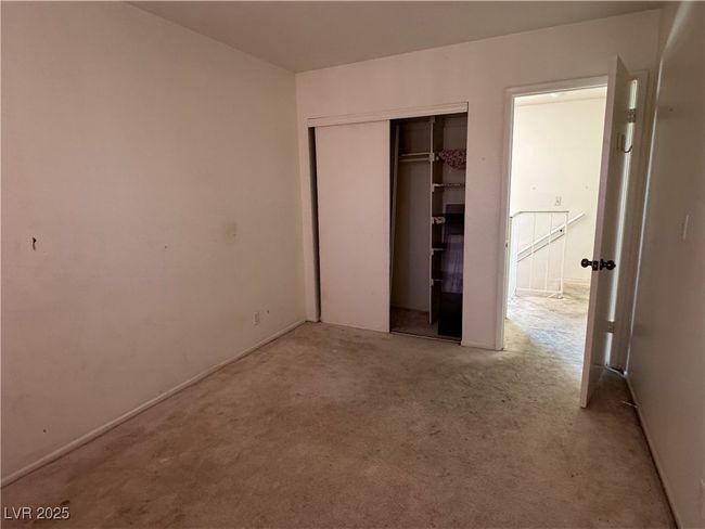 Unfurnished bedroom with carpet and a closet | Image 10