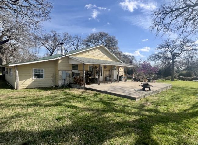 Rear view of house with a patio and a yard | Image 17
