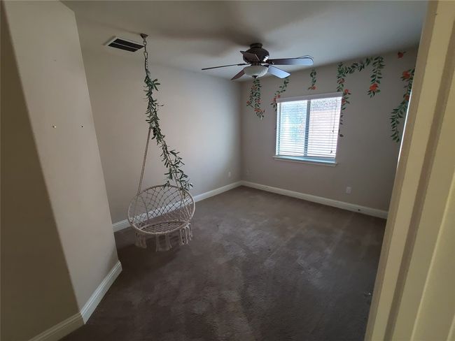 Spare room with carpet flooring and ceiling fan | Image 26