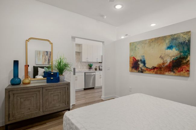 Well sized room is complete with recessed lighting and ceiling fan | Image 13