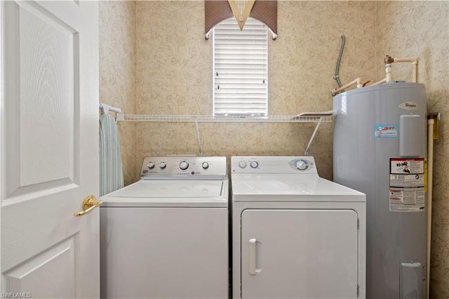Laundry room with water heater | Image 25