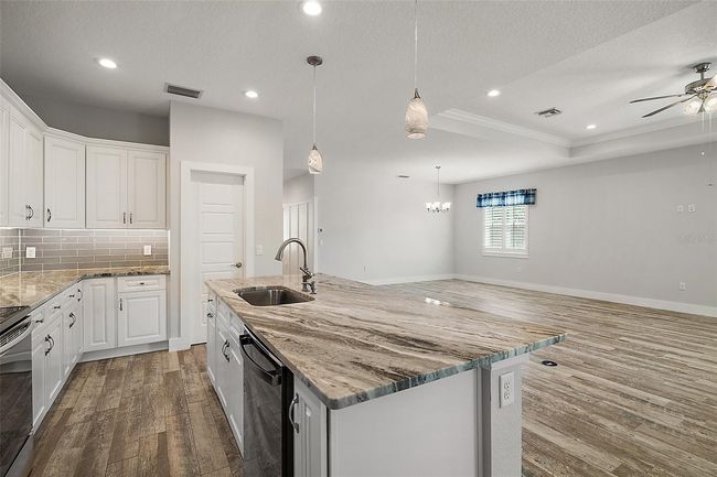 Kitchen overlooks the living and dining | Image 10