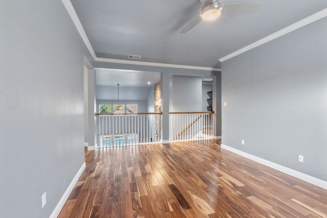 2nd living area is ideal for children to play, or turn into a game room or another office. Harwood floors look awesome. | Image 16