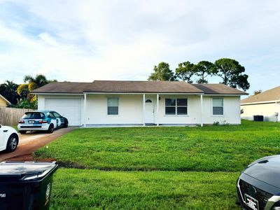 471 Se Langfield Avenue, House other with 4 bedrooms, 3 bathrooms and null parking in Port St Lucie FL | Image 1