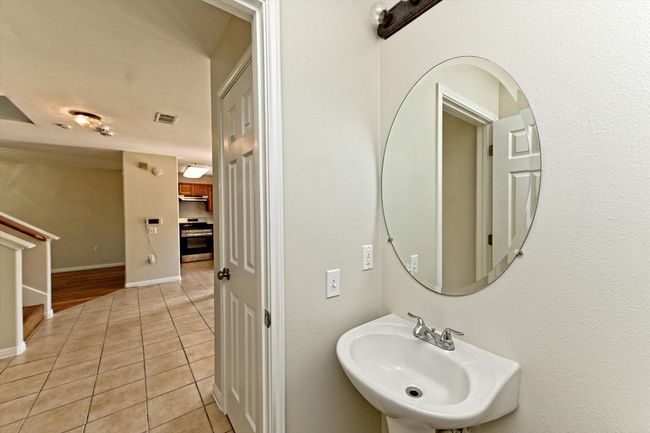 Convenient downstairs powder room. | Image 16