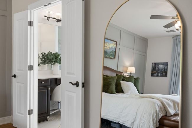 Bedroom with ceiling fan, light wood-type flooring, and visible vents | Image 24