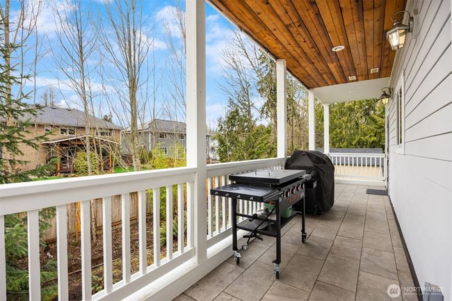 Covered back deck has plenty of room for grills and outdoor furniture. | Image 15