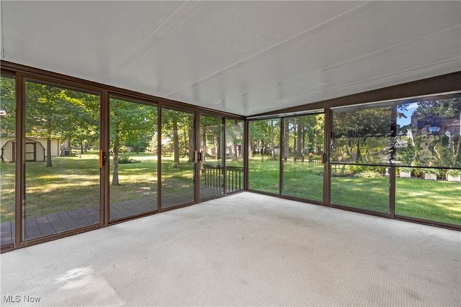 Unfurnished sunroom featuring healthy amount of natural light | Image 16