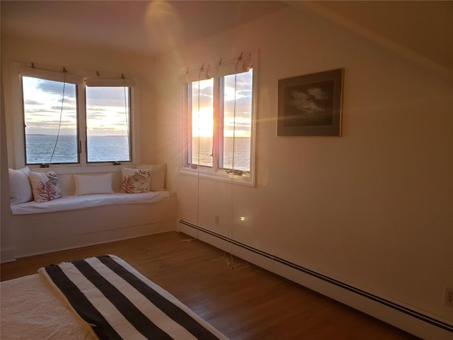 Waterview window seat spacious bedroom at sunset | Image 32