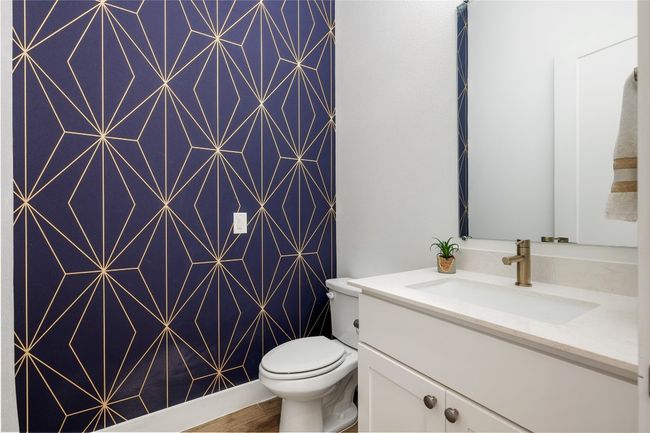 Half bath on first floor serves the kitchen, living room, and dining room. | Image 26