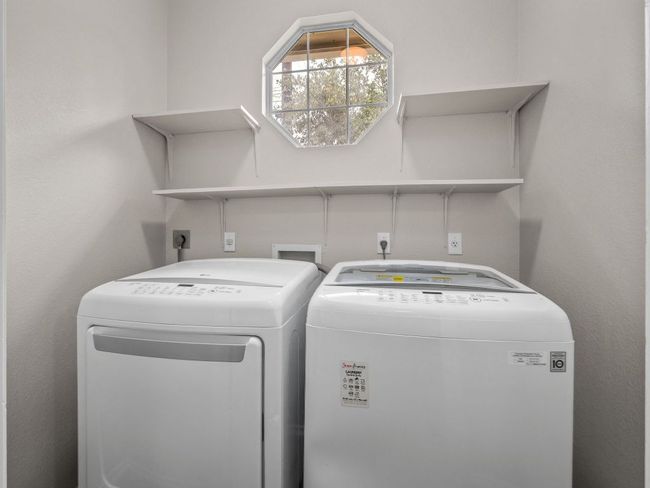 Laundry room featuring laundry area and washer and clothes dryer | Image 19
