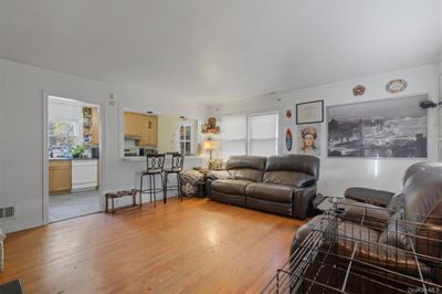 Living room featuring light hardwood / wood-style floors | Image 3