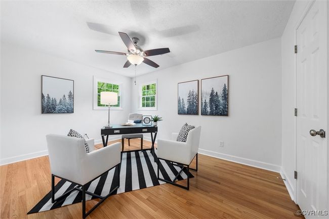 Largest bedroom on second level with two closets, hardwood floors, and ceiling fan | Image 17