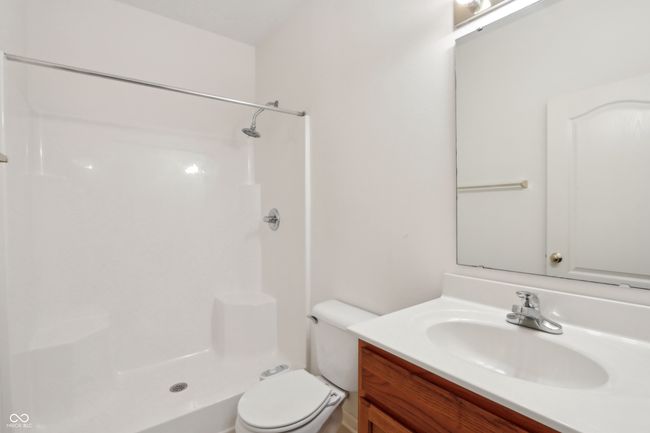 full bathroom featuring toilet, walk in shower, and vanity | Image 22