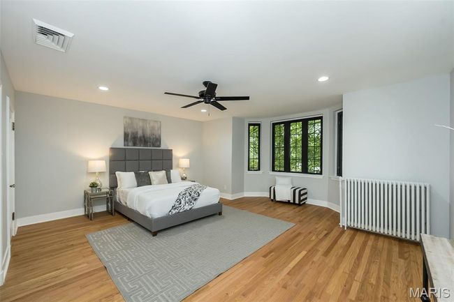 Large primary bedroom with walk in closet and bay window! | Image 13