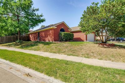 View of front of property with a garage and a front yard | Image 2