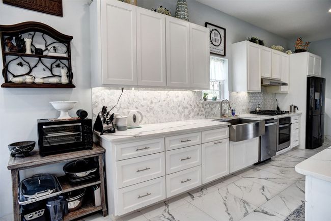 Large kitchen counter and lots of cabinets! | Image 17