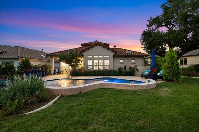 Rear view of home at dusk. | Image 37