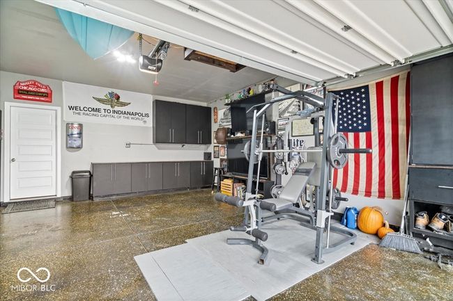 workout room with a garage | Image 34