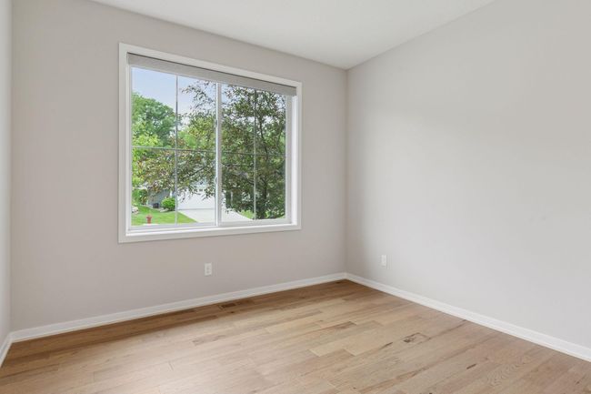 2nd Bedroom is nice sized and located to the left of the foyer featuring closet and overlooks the front yard | Image 31