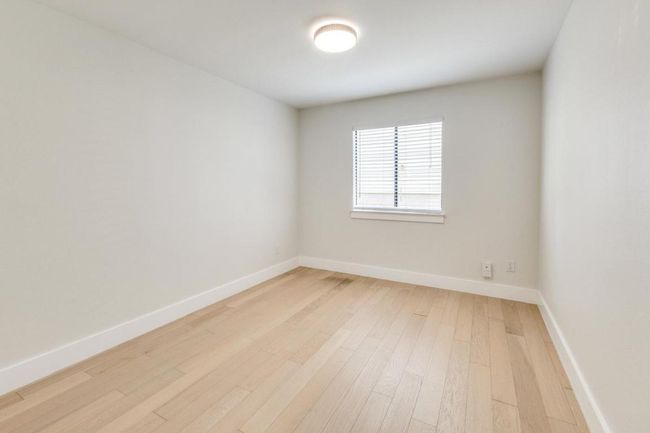 Empty room featuring baseboards and light wood-type flooring | Image 17