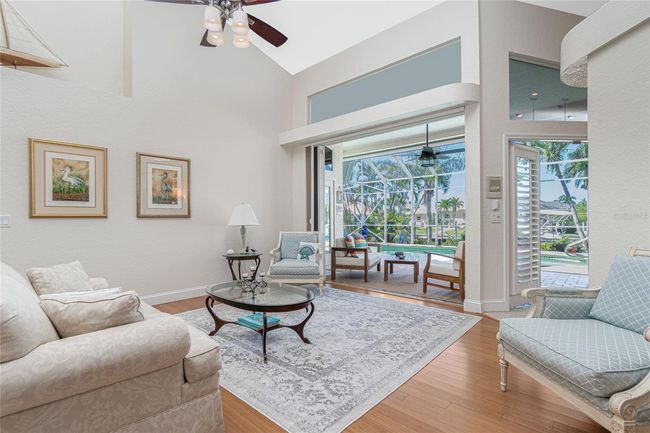 Bamboo flooring and pocketing sliders to the lanai | Image 7