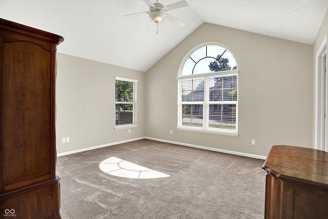 Spacious 2nd Bedroom with Huge Walk-in Closet, Vaulted ceiling, and a ceiling fan. | Image 23