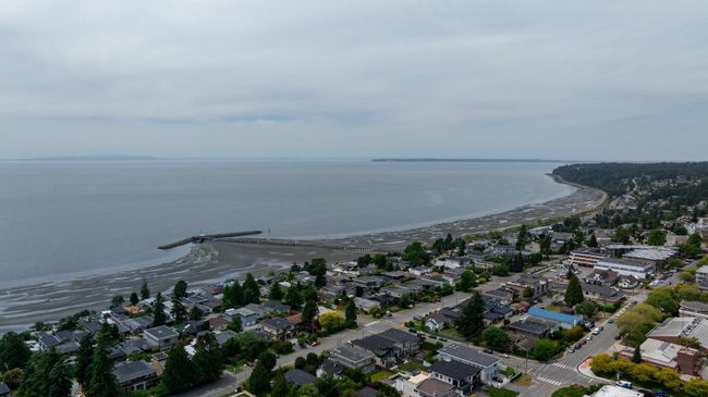 Aerial overview of property's location featuring a nearby body of water and nearby suburban area | Image 30