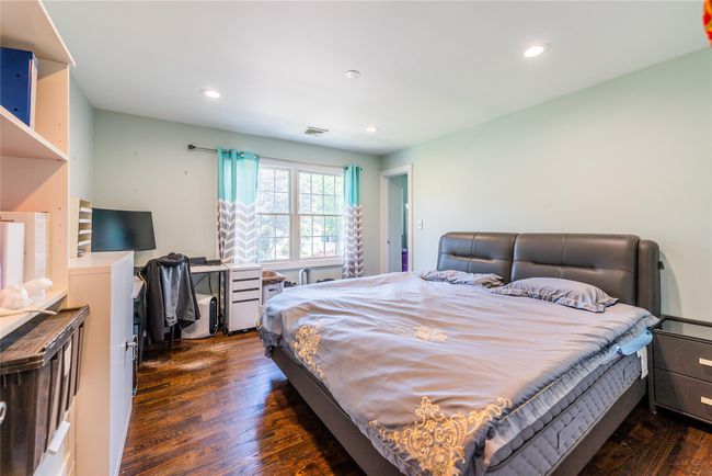 Bedroom featuring dark wood-style flooring and recessed lighting | Image 10