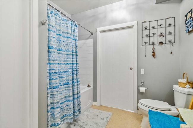 Bathroom featuring shower / bath combo and toilet | Image 22