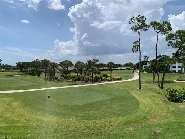 View of property's community with golf course view and a yard | Image 24