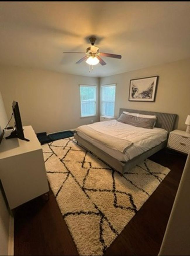 Bedroom featuring wood finished floors and a ceiling fan | Image 10