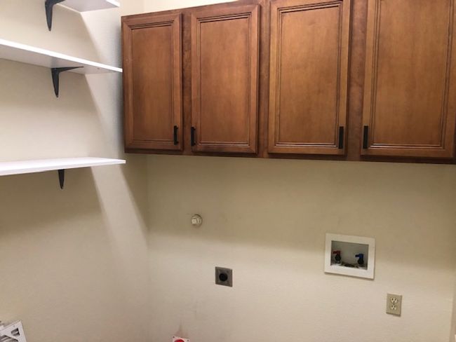 Laundry area with hookup for an electric dryer, hookup for a washing machine, cabinet space | Image 13