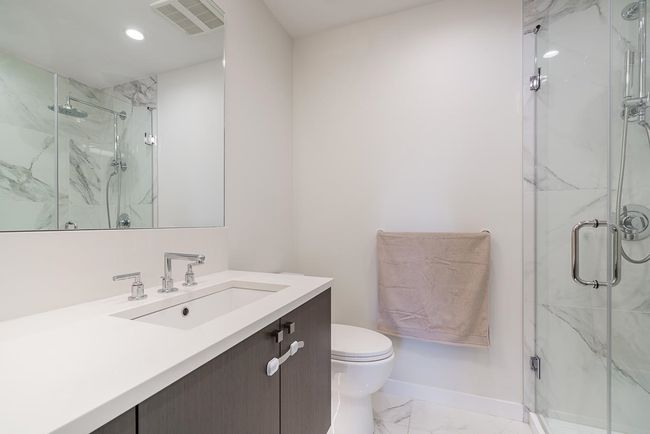 Bathroom with toilet, visible vents, marble finish floor, and a marble finish shower | Image 20