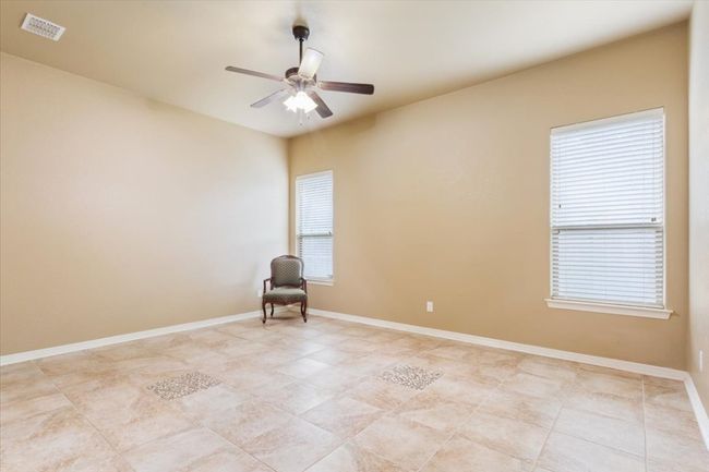 Empty room featuring baseboards, visible vents, and ceiling fan | Image 20