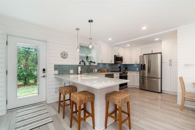 ** DOWNSTAIRS ** 1 BED + DEN / 1 BATH featuring an OPEN CONCEPT COASTAL INSPIRED DESIGN with lots of natural light. | Image 2