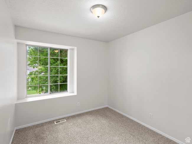 Carpeted spare room featuring baseboards | Image 19