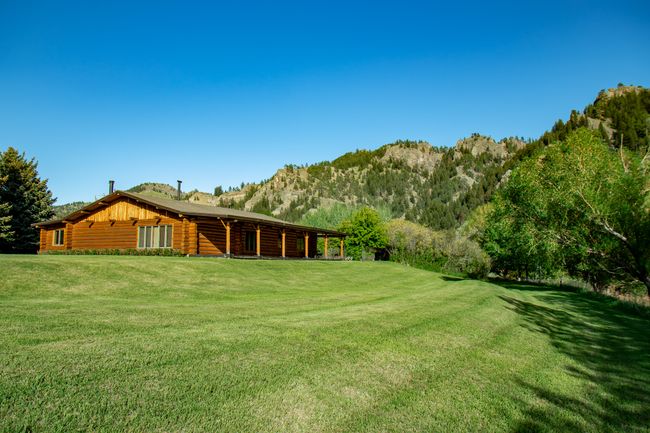 View of grassy yard with a mountain view | Image 11