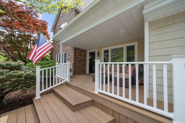 Back of property with a storage unit, a gate, an outdoor structure, and a deck | Image 5