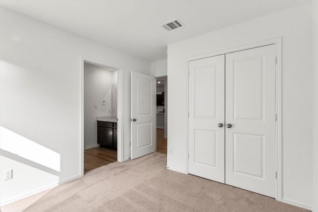 Unfurnished bedroom featuring carpet, a closet, and connected bathroom | Image 23