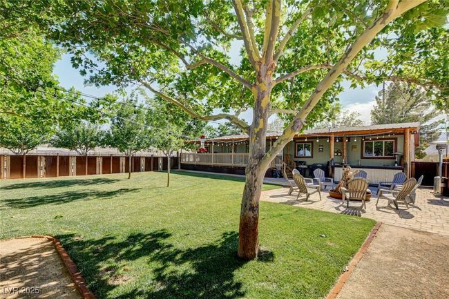 Fenced backyard featuring a patio | Image 41