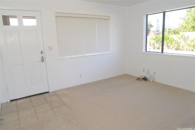 Living room as you enter through the front door. | Image 3