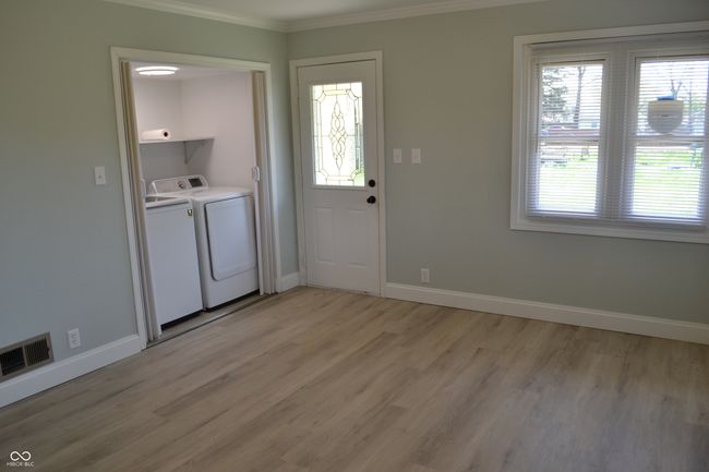 Dining area is spacious with laundry on main floor | Image 20
