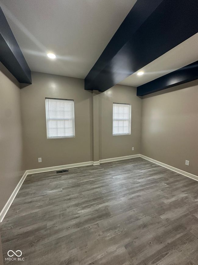 Unit 1 - Master unfurnished room with wood finished floors and recessed lighting | Image 10