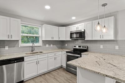 NEW Kitchen w/ NEW White Shaker Cabinets, NEW Granite Countertops, NEW Tile Backsplash, NEW Recessed Lighting & Newer Stainless Steel Appliances | Image 3