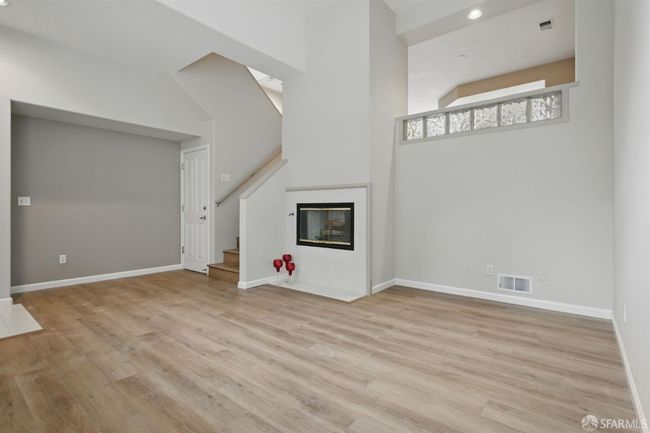 Overview of living room open to family room above | Image 8