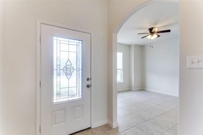 Tiled foyer entrance with ceiling fan | Image 3