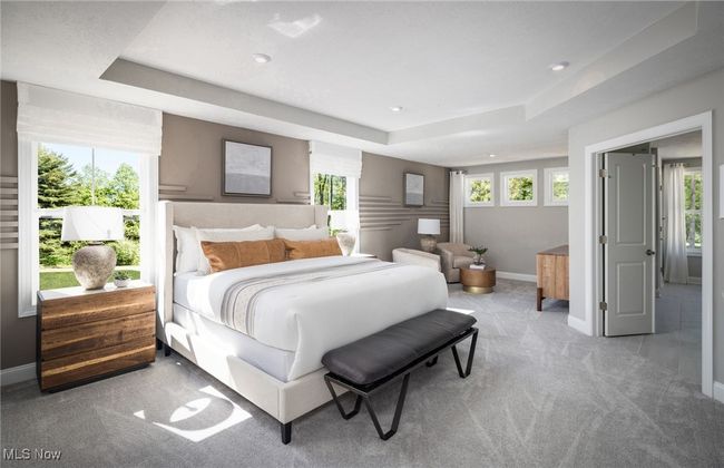 Grand owner's suite bedroom with separate sitting area and double door entry into en-suite bathroom. | Image 7